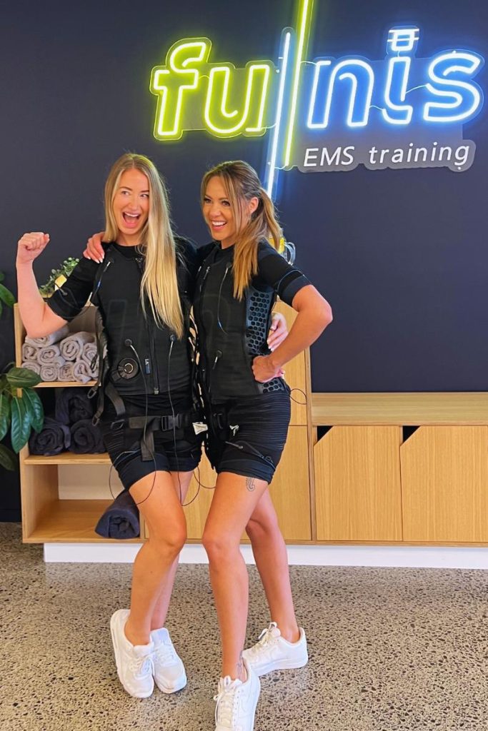 two happy women after successful ems workout